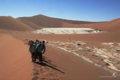 Climbing the large Red Sanddunes at Sossusvlei in Namibia